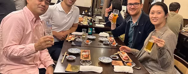 Having fun at a Japanese sushi bar with dentist colleagues.